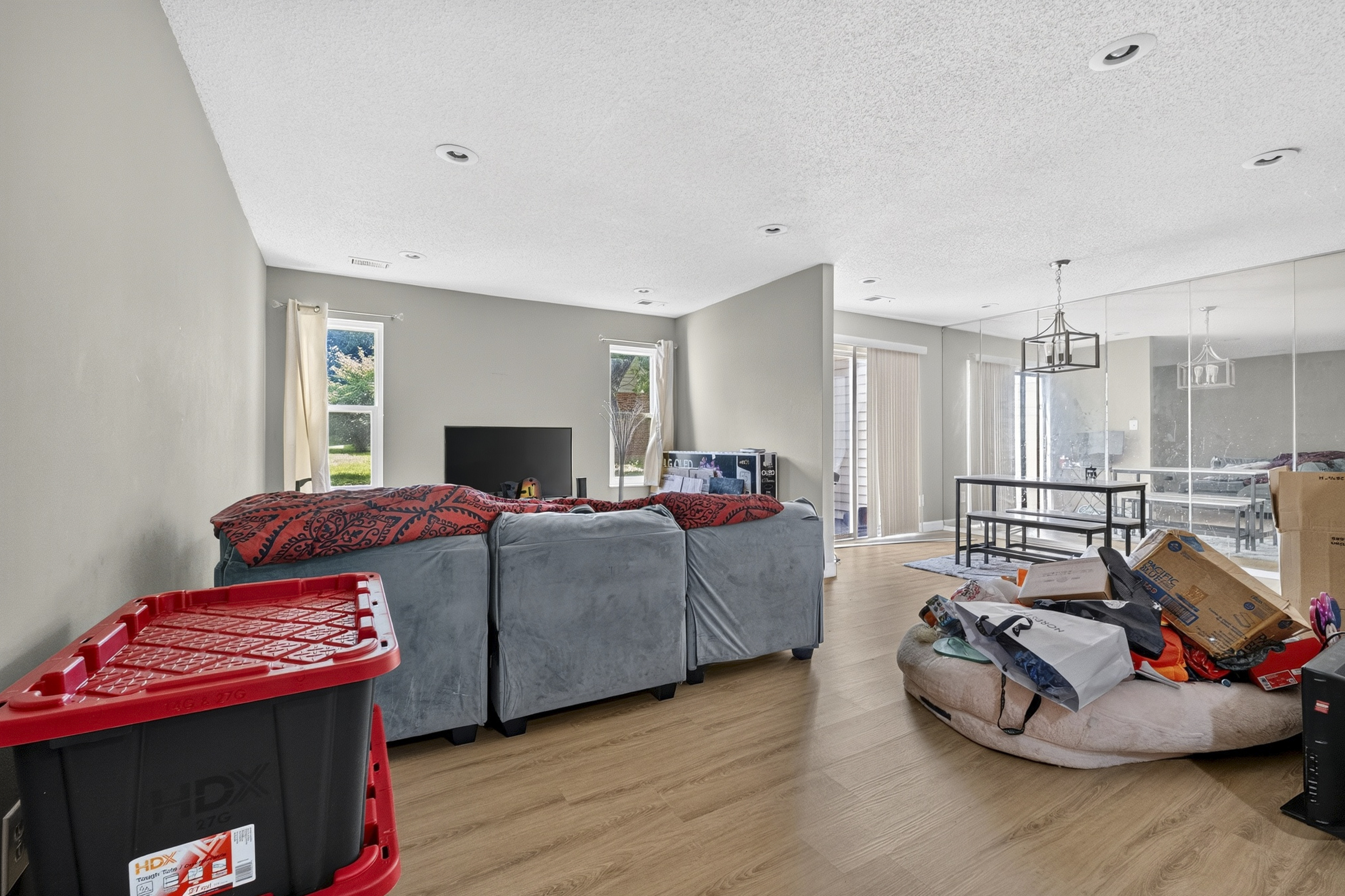 Cluttered living room before item removal