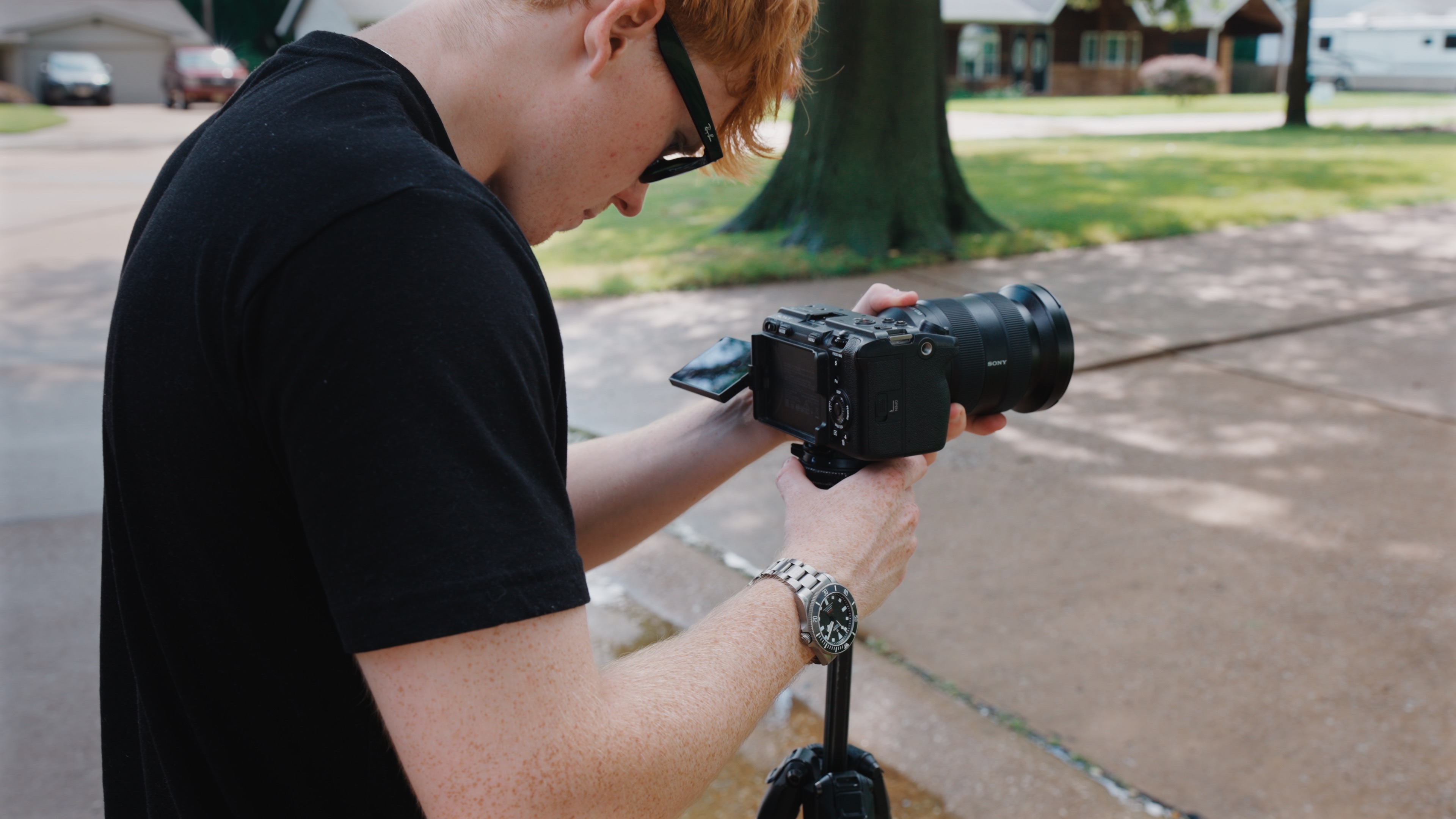 Property Flix videographer filming a home exterior